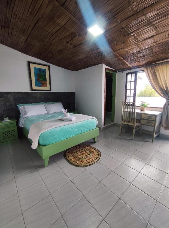 Postel nebo postele na pokoji v ubytování Finca San Alejandro