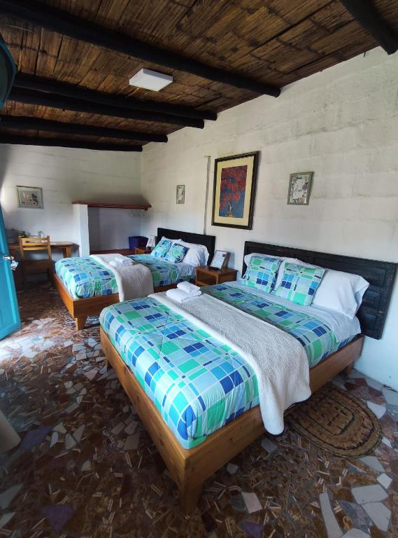 Postel nebo postele na pokoji v ubytování Finca San Alejandro