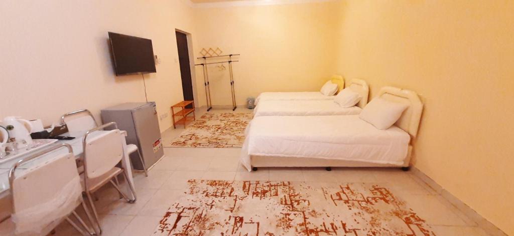 TV a/nebo společenská místnost v ubytování Hostel Erfan