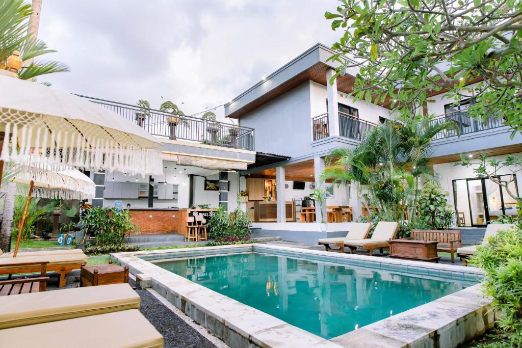 an image of a villa with a swimming pool at Lemon Guest House in Canggu