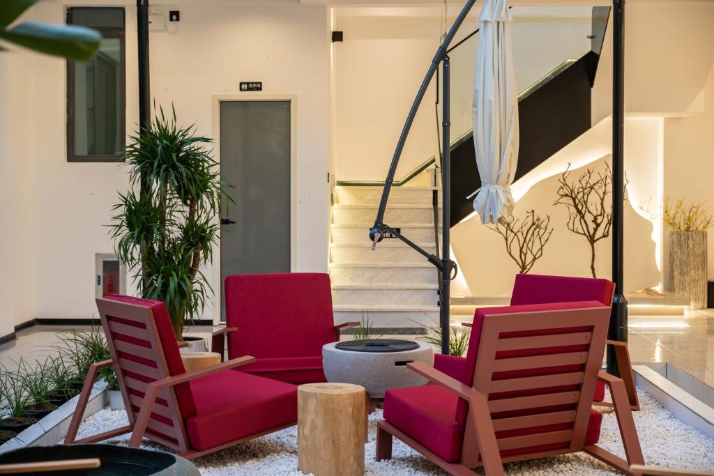 TV a/nebo společenská místnost v ubytování Dali Yufu B&B Hotel