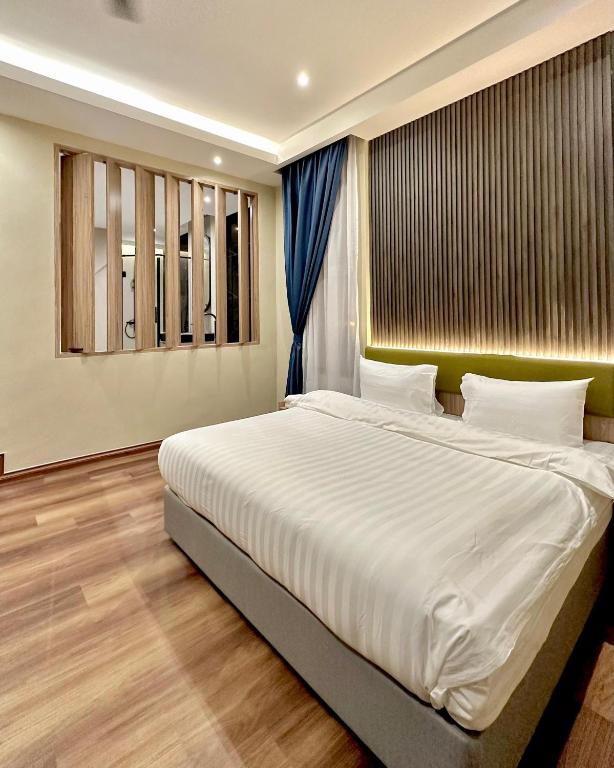 Postel nebo postele na pokoji v ubytování I-VISTA HOTEL