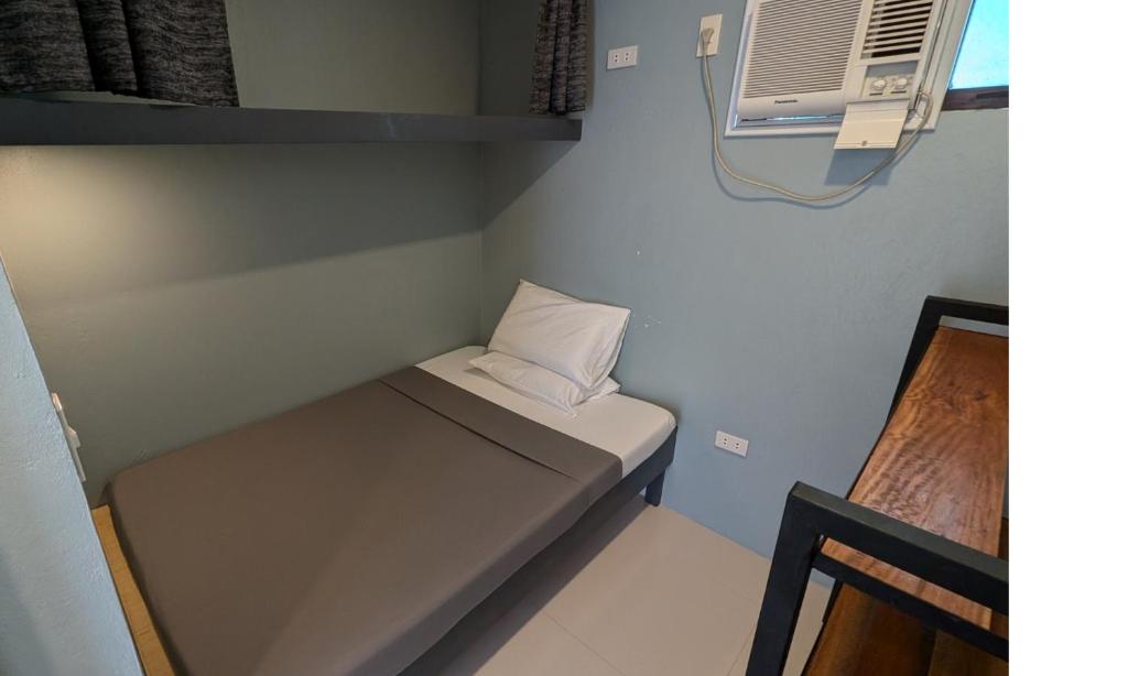 Voodi või voodid majutusasutuse Tipolo Guesthouse toas