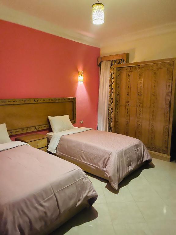 Postel nebo postele na pokoji v ubytování Jewel Howard Carter Hotel