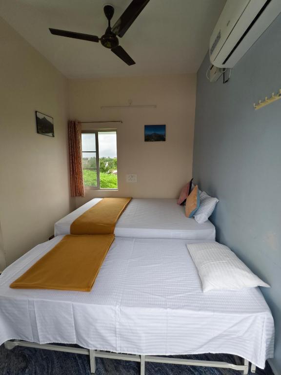 Postel nebo postele na pokoji v ubytování RPM home stay