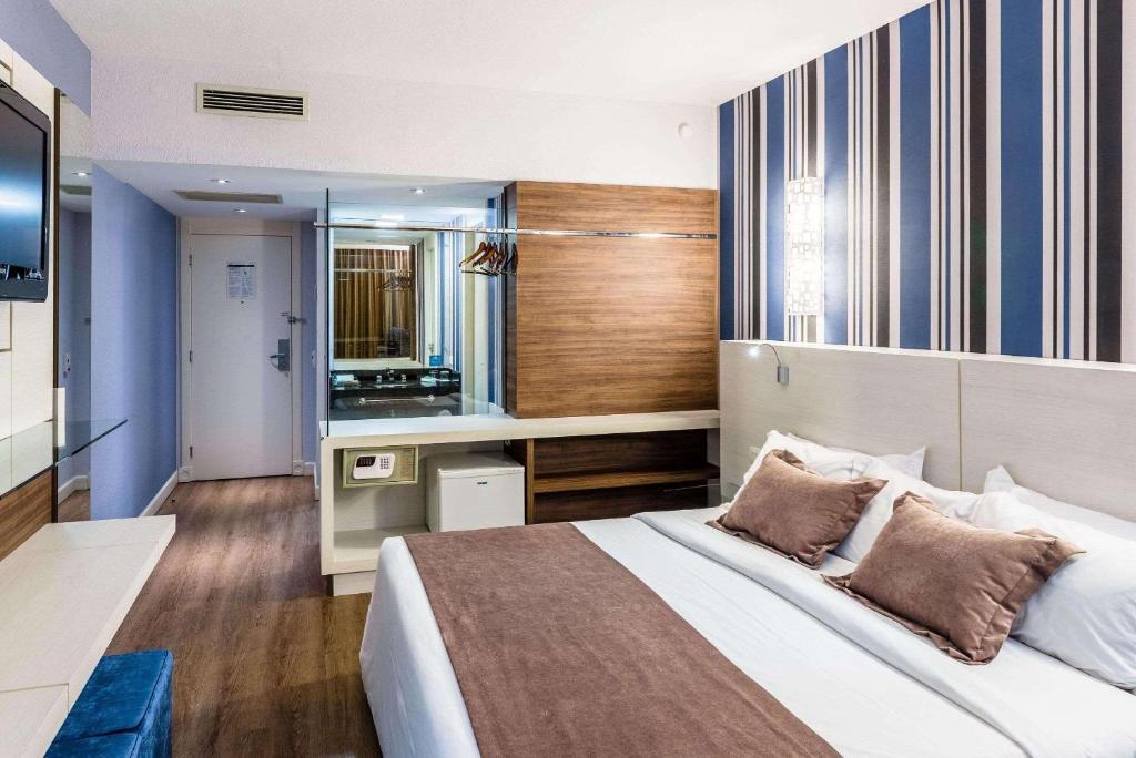 Postel nebo postele na pokoji v ubytování Radisson Hotel Curitiba