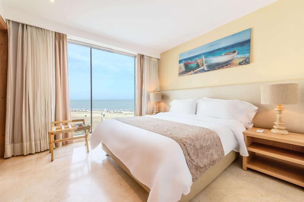 Postel nebo postele na pokoji v ubytování Radisson Cartagena Ocean Pavillion Hotel