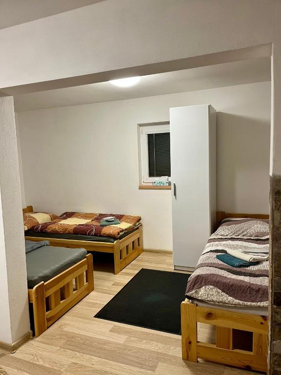 Postel nebo postele na pokoji v ubytování Ubytování Koliba pod Stolovou