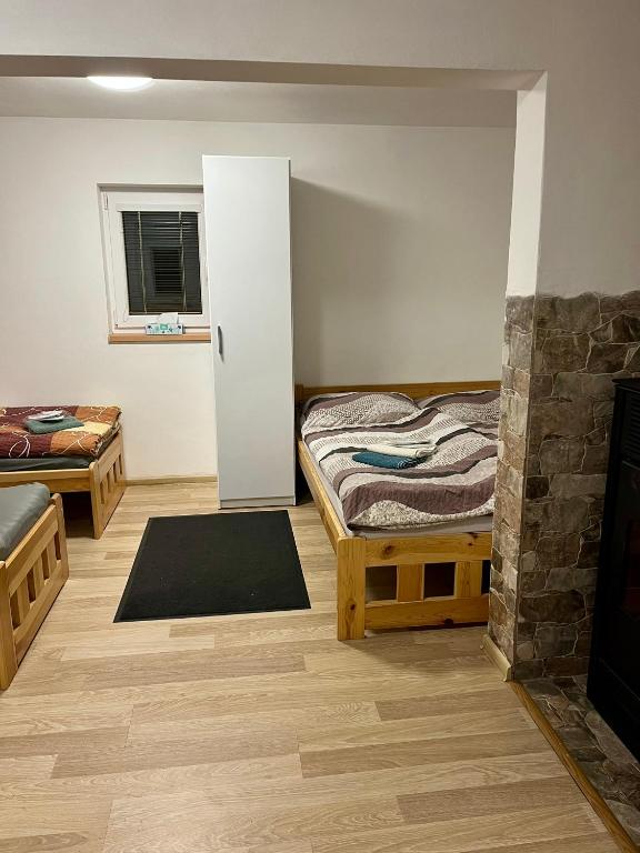 Postel nebo postele na pokoji v ubytování Ubytování Koliba pod Stolovou