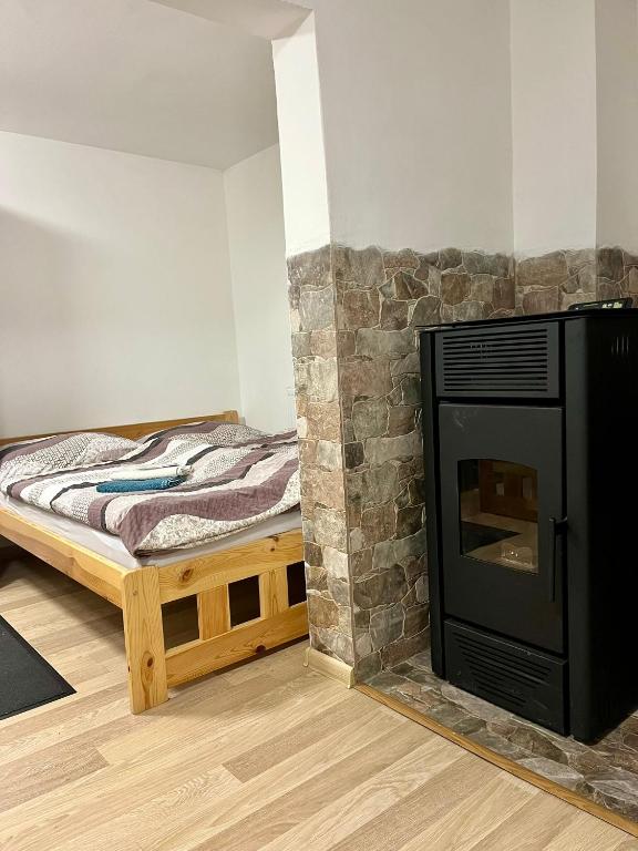 Postel nebo postele na pokoji v ubytování Ubytování Koliba pod Stolovou
