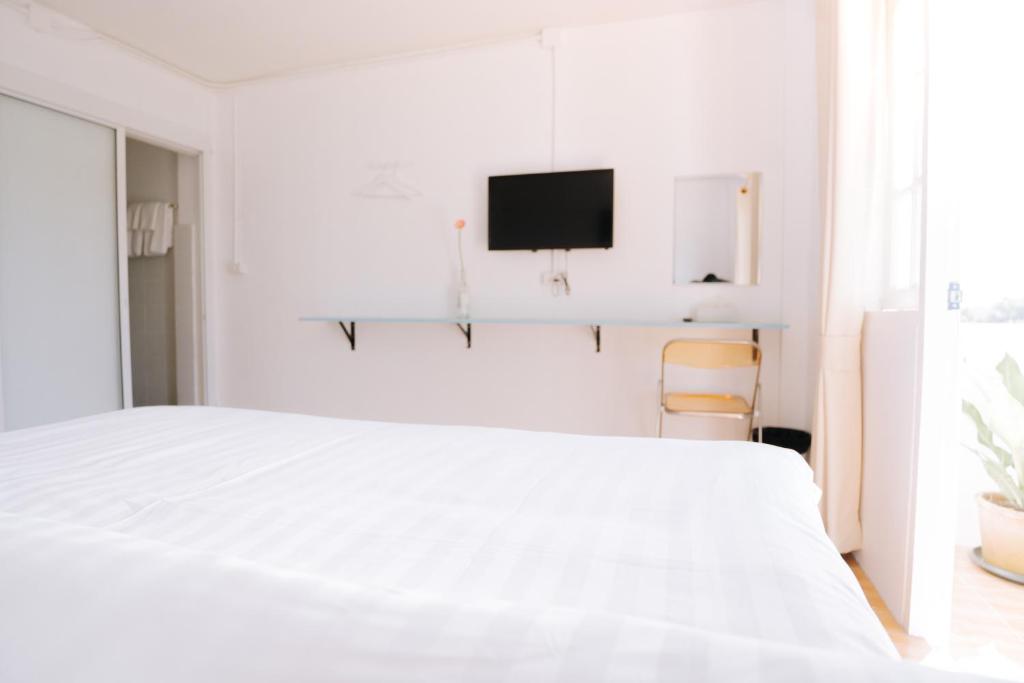 Postel nebo postele na pokoji v ubytování B&B Chiangrai