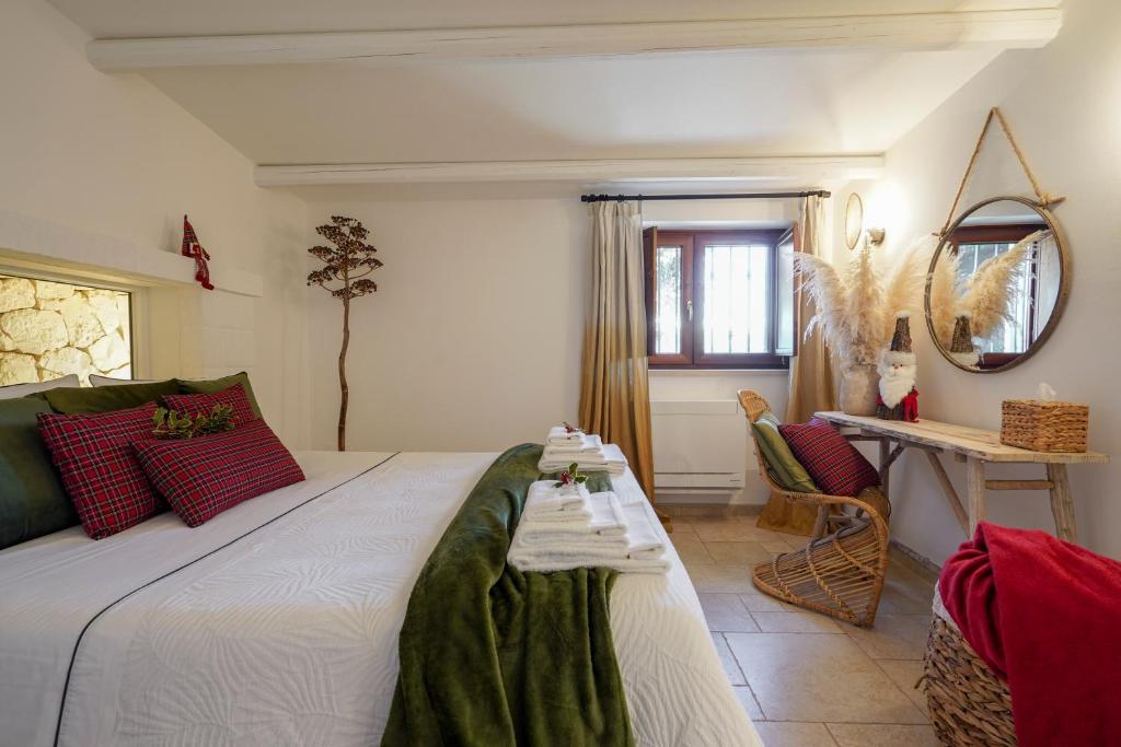 A bed or beds in a room at Trullo Natù - private villa
