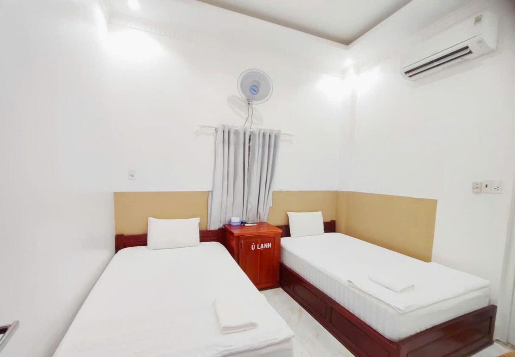 Postel nebo postele na pokoji v ubytování Sao Mai Hotel Can Tho