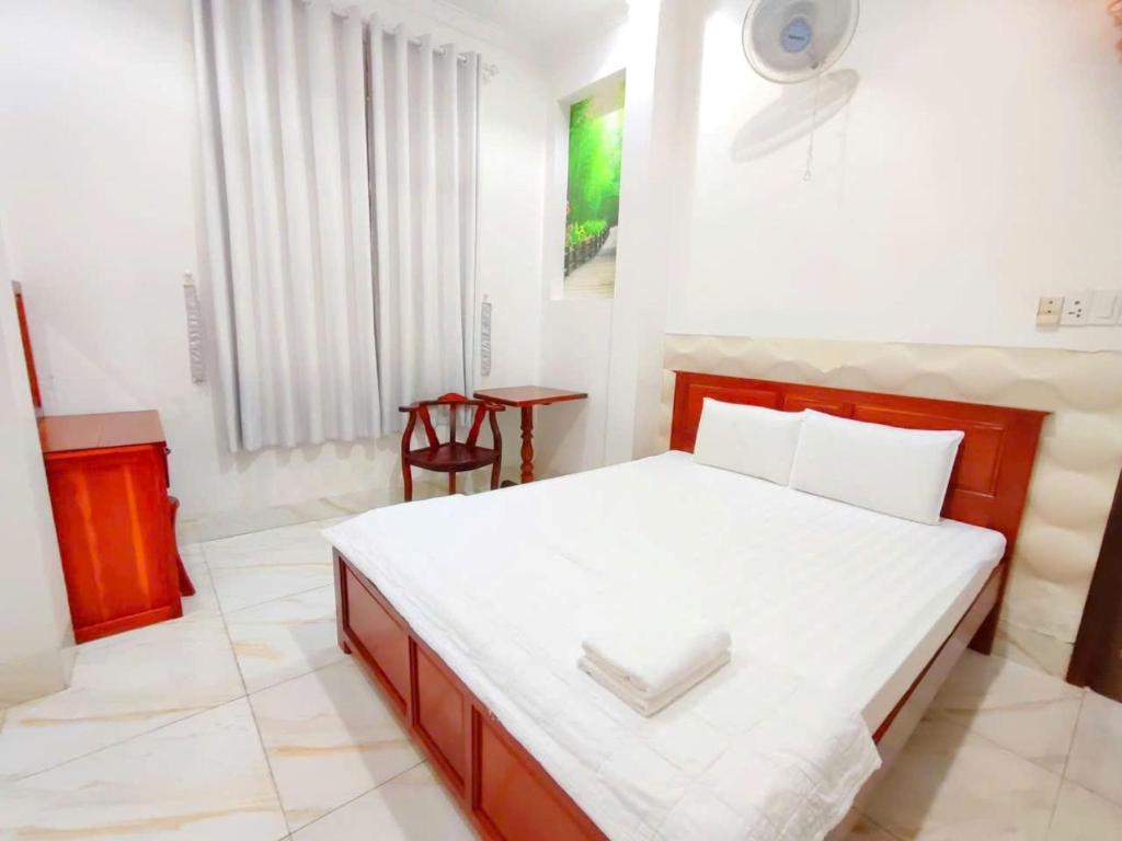 Postel nebo postele na pokoji v ubytování Sao Mai Hotel Can Tho