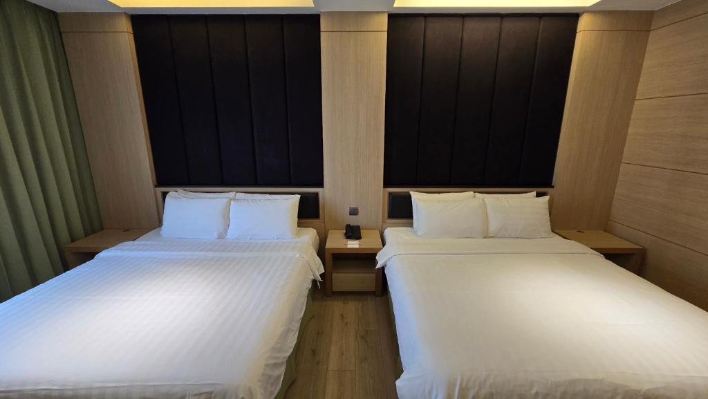 Postel nebo postele na pokoji v ubytování Hotel R14