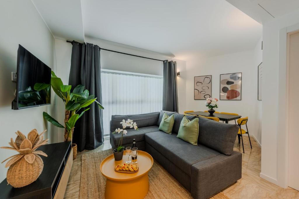 a living room with a couch and a table at Sweett - Mazzini in Milan