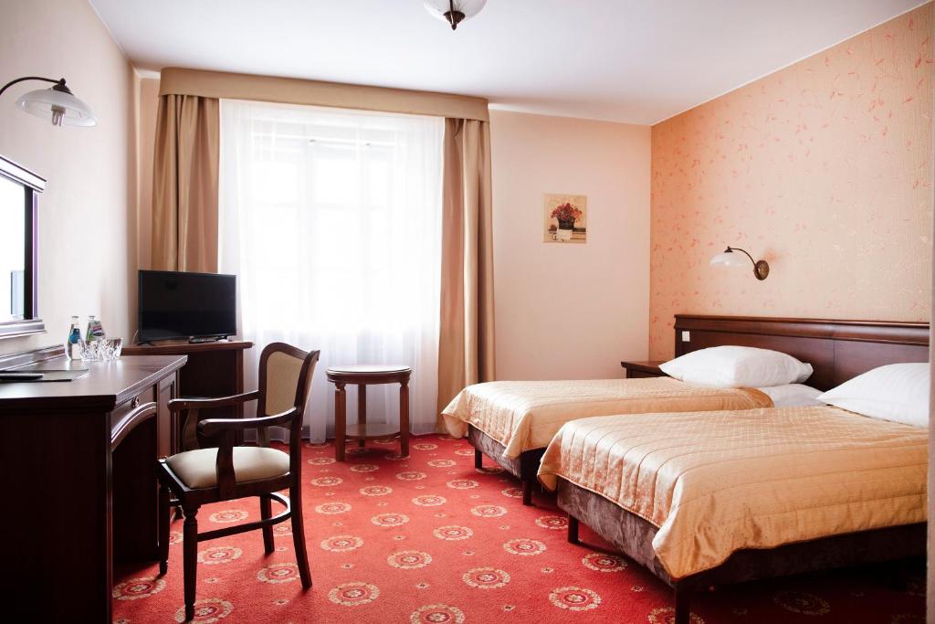 Posteľ alebo postele v izbe v ubytovaní Hotel Arkadia Royal