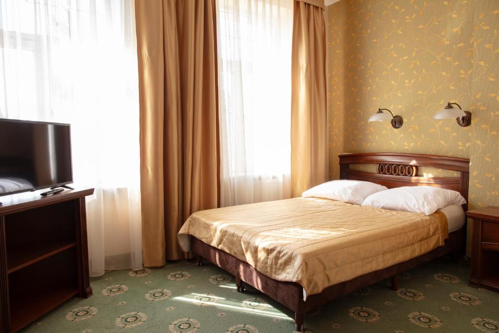 Posteľ alebo postele v izbe v ubytovaní Hotel Arkadia Royal