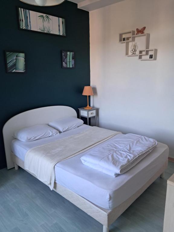 Postel nebo postele na pokoji v ubytování Le porquerolle