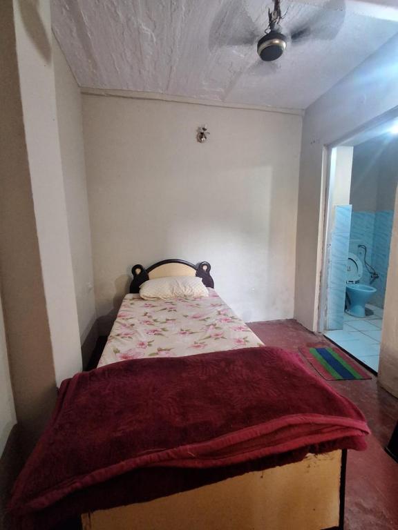 Postel nebo postele na pokoji v ubytování Hotel Om Pushkar