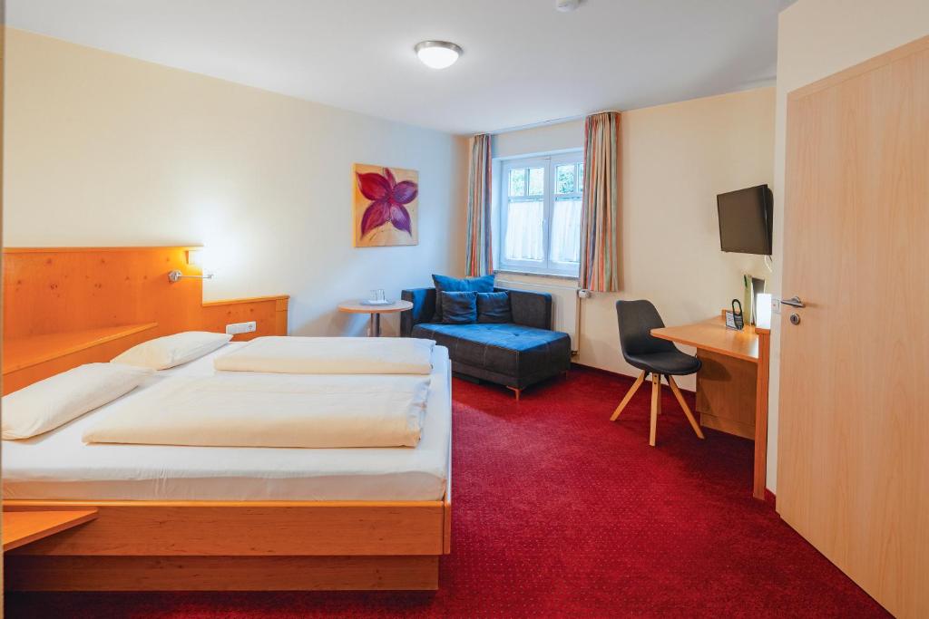 Postel nebo postele na pokoji v ubytování Hotel Pension Futterknecht