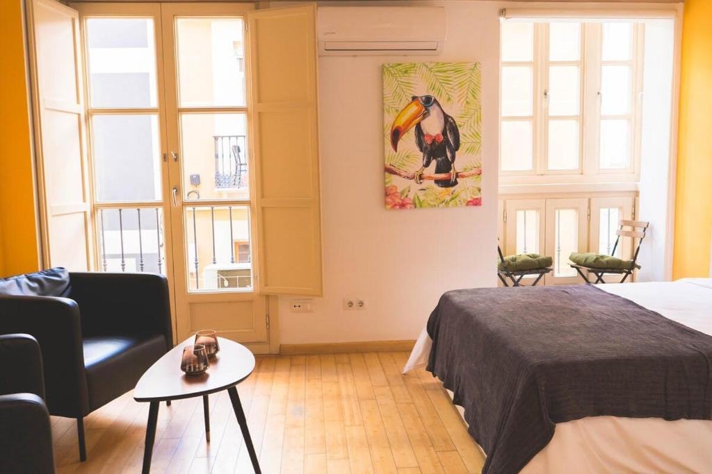 Posteľ alebo postele v izbe v ubytovaní Céntrico Estudio - Málaga centro