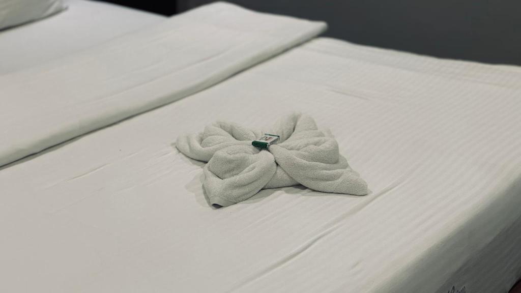 Postel nebo postele na pokoji v ubytování Luxe Inn