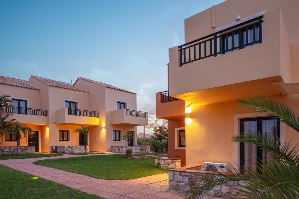 an exterior view of a house with a courtyard at Dia Apartments in Hersonissos