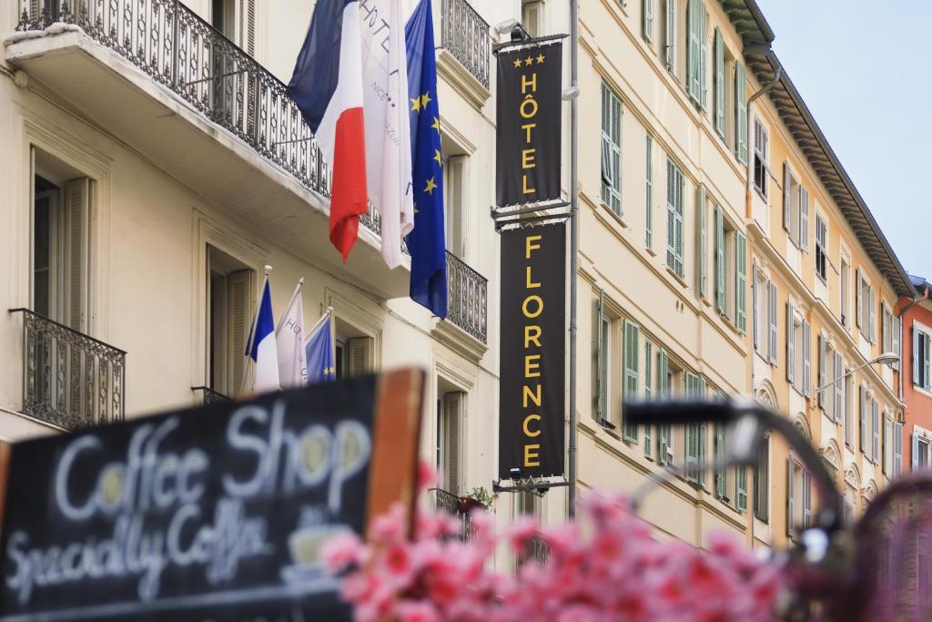 a sign for a hotel on the side of a building at Hotel Florence Nice in Nice