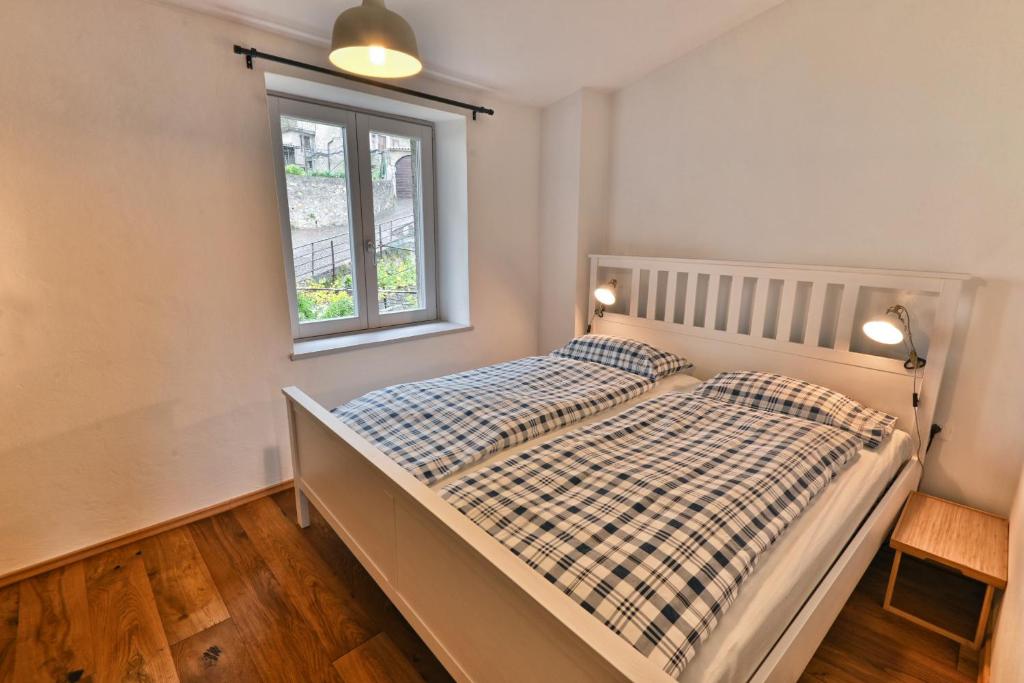 Ένα ή περισσότερα κρεβάτια σε δωμάτιο στο Casa Greta - Theater Home