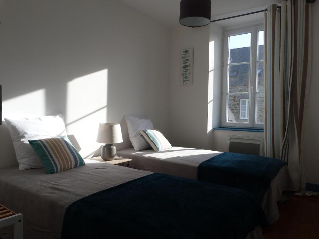 Postel nebo postele na pokoji v ubytování Gîte la presqu'ile