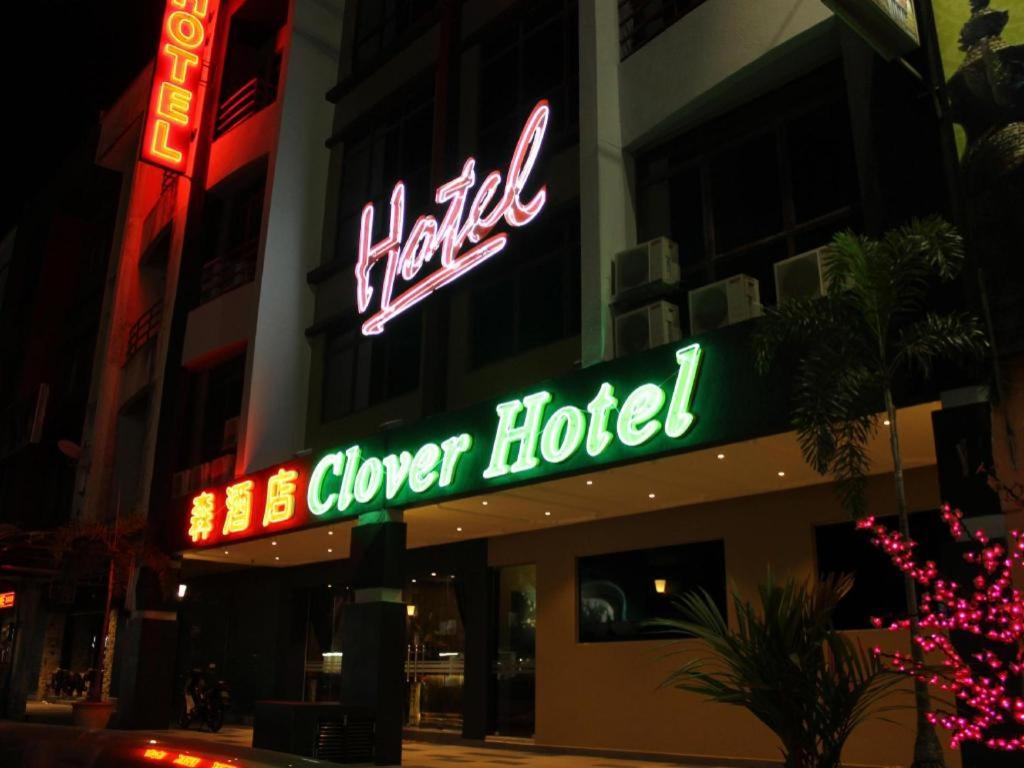 a neon sign for a hotel on a building at Clover Hotel in Johor Bahru