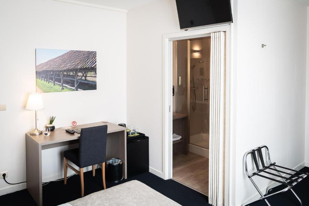 Postel nebo postele na pokoji v ubytování Hotel Essenza