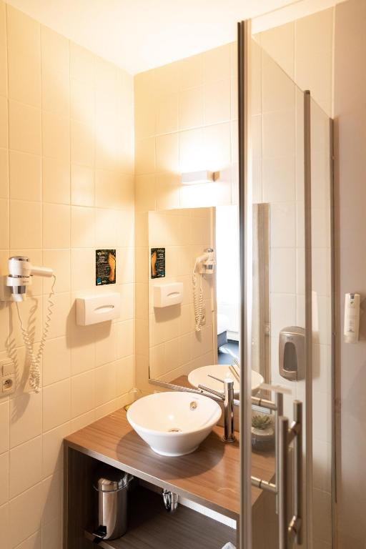 Koupelna v ubytování Hotel Essenza