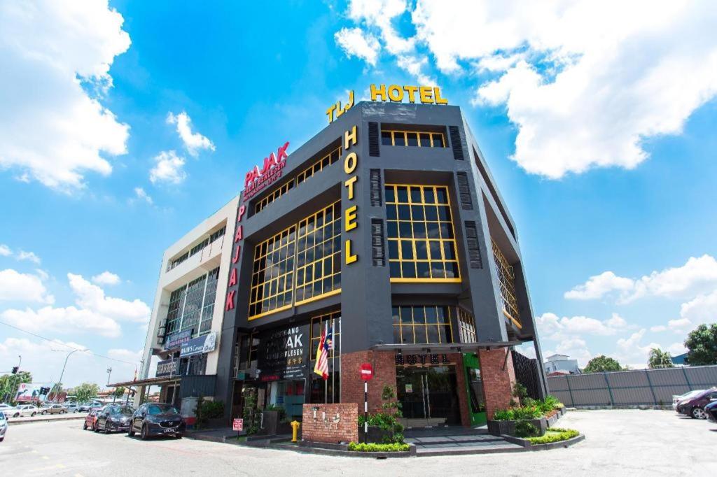 a building with a hotel sign on top of it at TLJ HOTEL in Klang