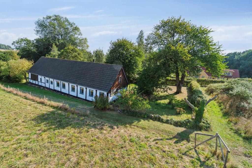 an aerial view of a barn in a field at Cozy Summer House On Bornholm in Neksø