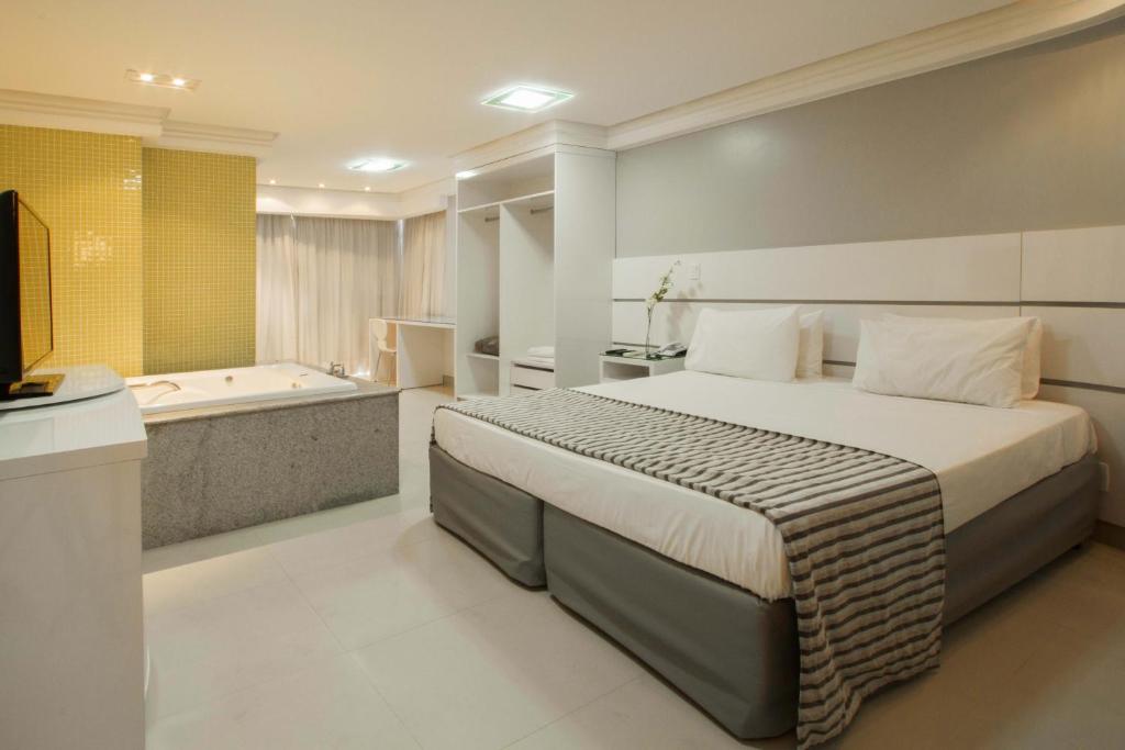 Ένα ή περισσότερα κρεβάτια σε δωμάτιο στο Brisa Tower Hotel