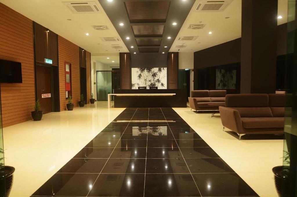 a lobby with a waiting area with couches and a lobby at Star-Well hotel in Kuala Lipis