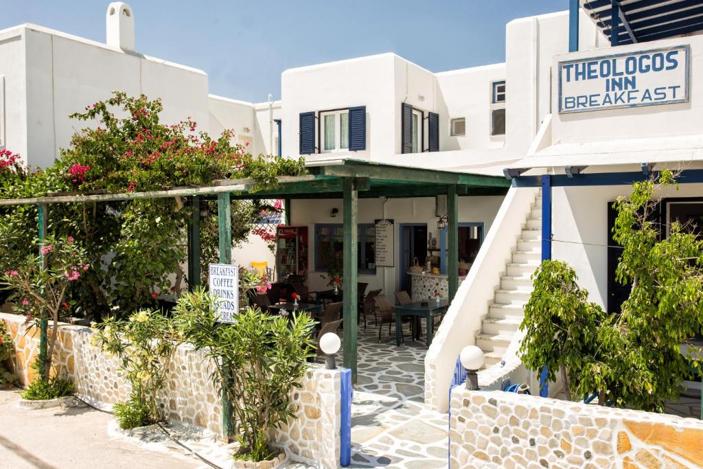 a building with a restaurant in front of it at Theologos Place in Antiparos