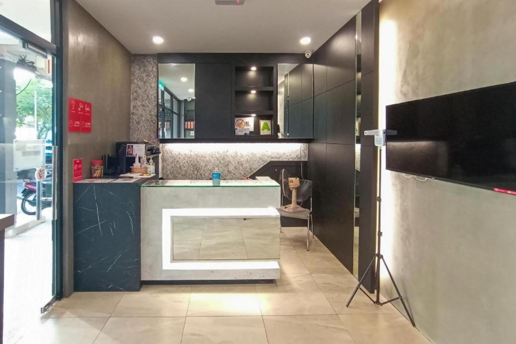 TV a/nebo společenská místnost v ubytování OYO 89578 Dung Fang Hotel No. 1 Sibu