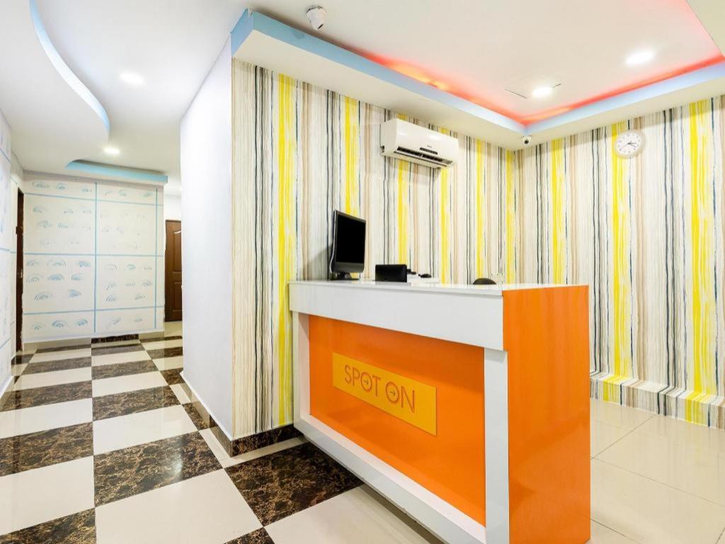 a lobby with a reception desk in a room at SPOT ON 89616 My Trillion Hotel in Kuala Lumpur