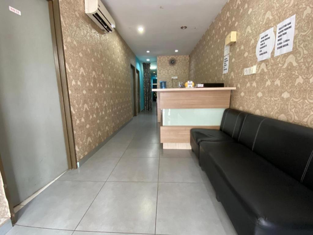 Posezení v ubytování OYO 89760 Harmoni Inn Hotel