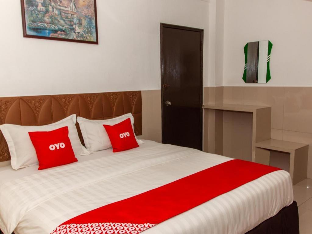 Кровать или кровати в номере OYO 89851 Leila Hotel