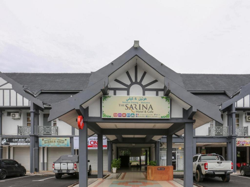 a building with a sign for a shopping center at OYO 89922 The Sarina Hotel & Cafe in Kampong Bukit Susun