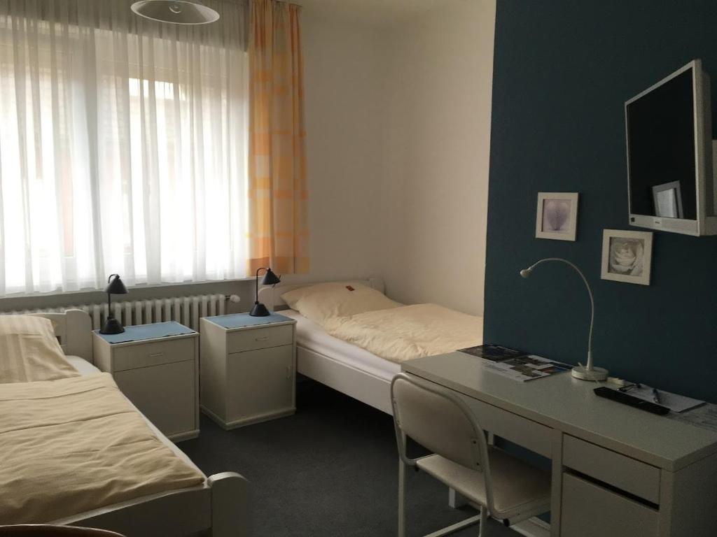 Postel nebo postele na pokoji v ubytování Hotel Wolbeck