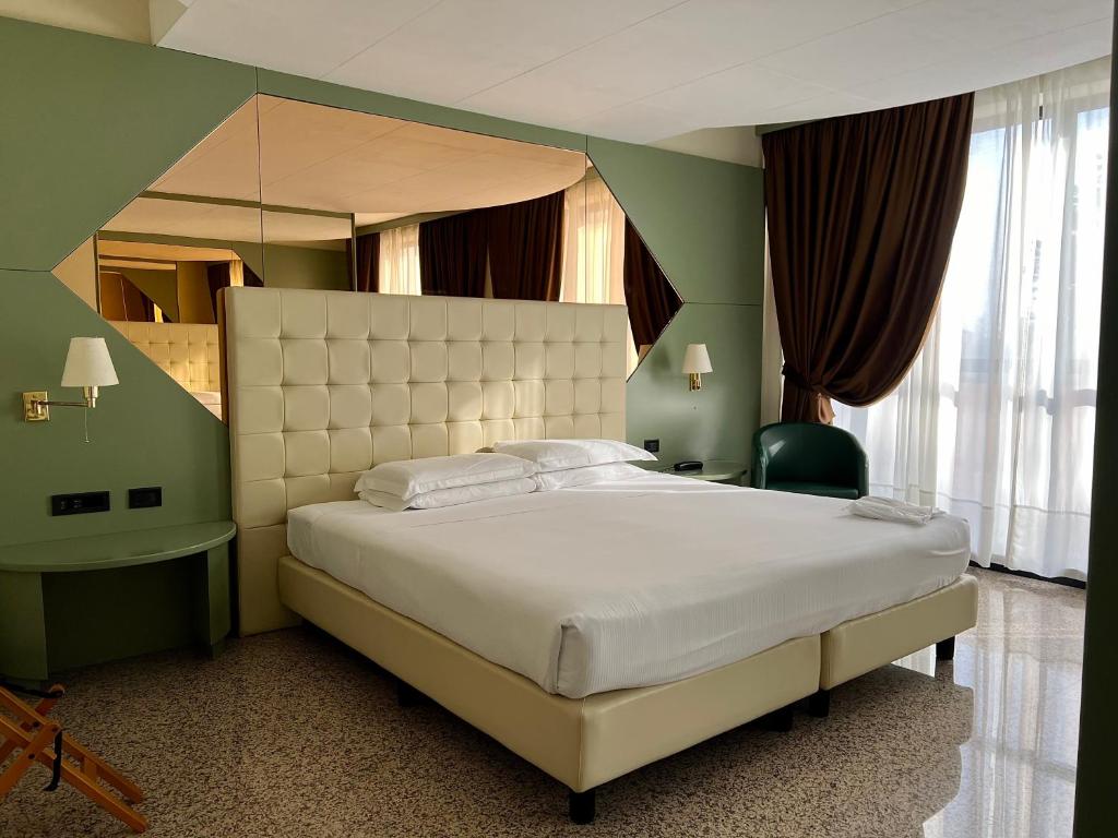 Postel nebo postele na pokoji v ubytování Hotel Diamante