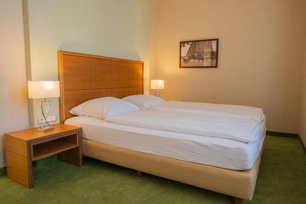 Postel nebo postele na pokoji v ubytování Gästehaus Heinrich Schüchtermann