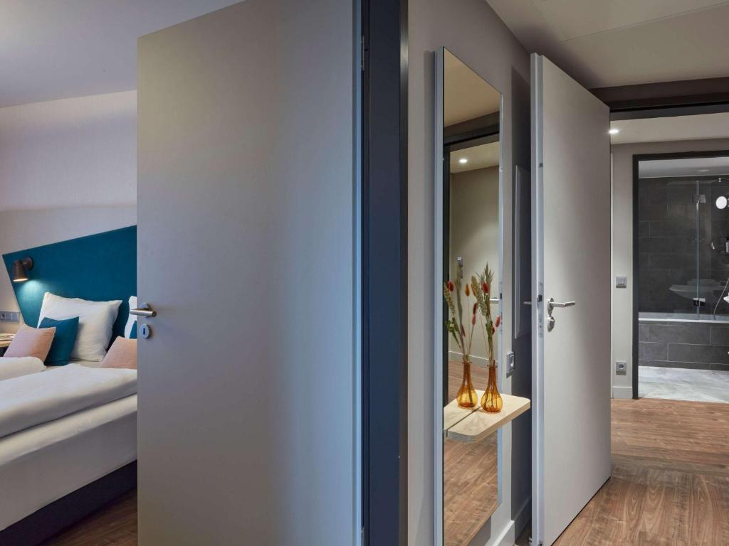Postel nebo postele na pokoji v ubytování Aparthotel Adagio Heidelberg