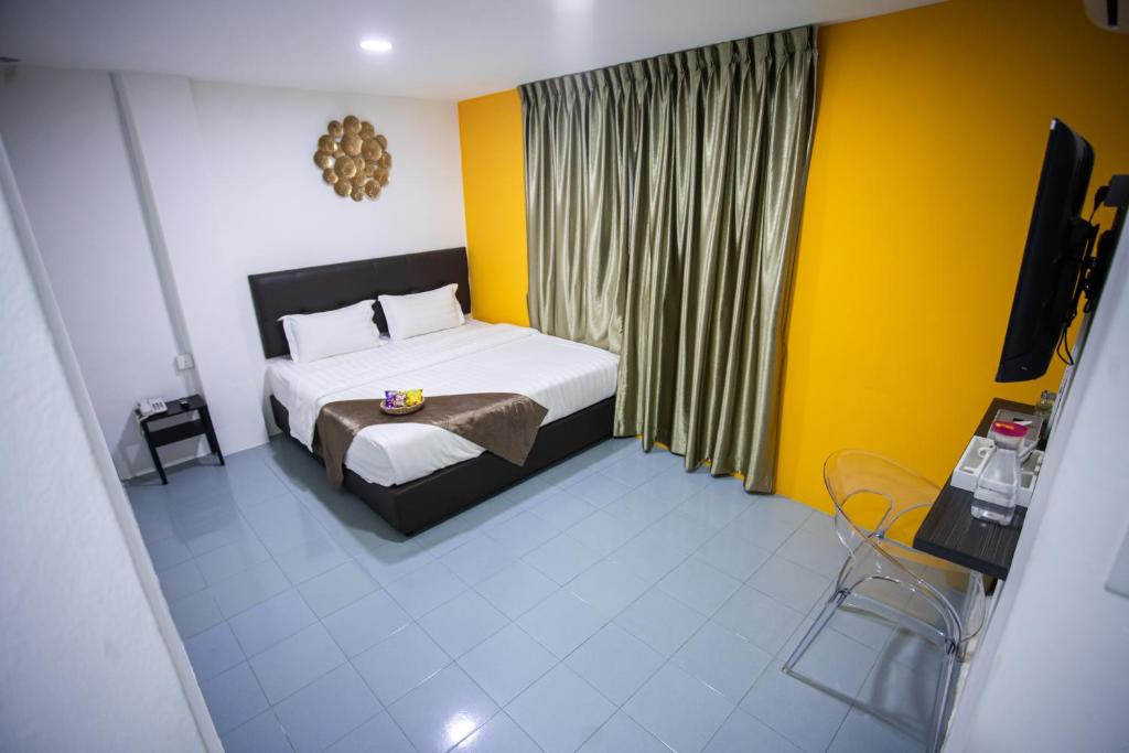 Postel nebo postele na pokoji v ubytování Rex City Hotel