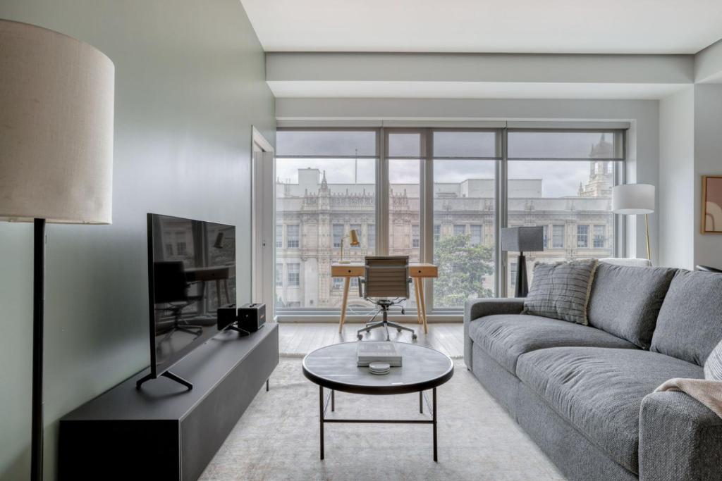 a living room with a couch and a table at Soma 2br w pet spa gym on-site yoga SFO-1479 in San Francisco